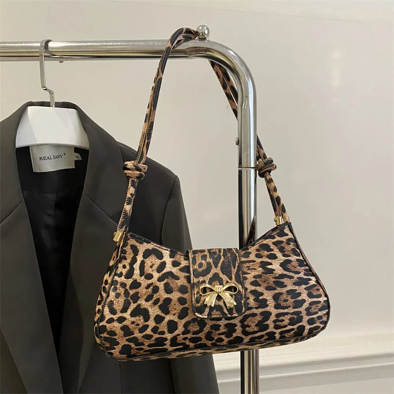 Women's casual handbag in black PU leather with sandwich pocket design measuring 27x13.5x6cm