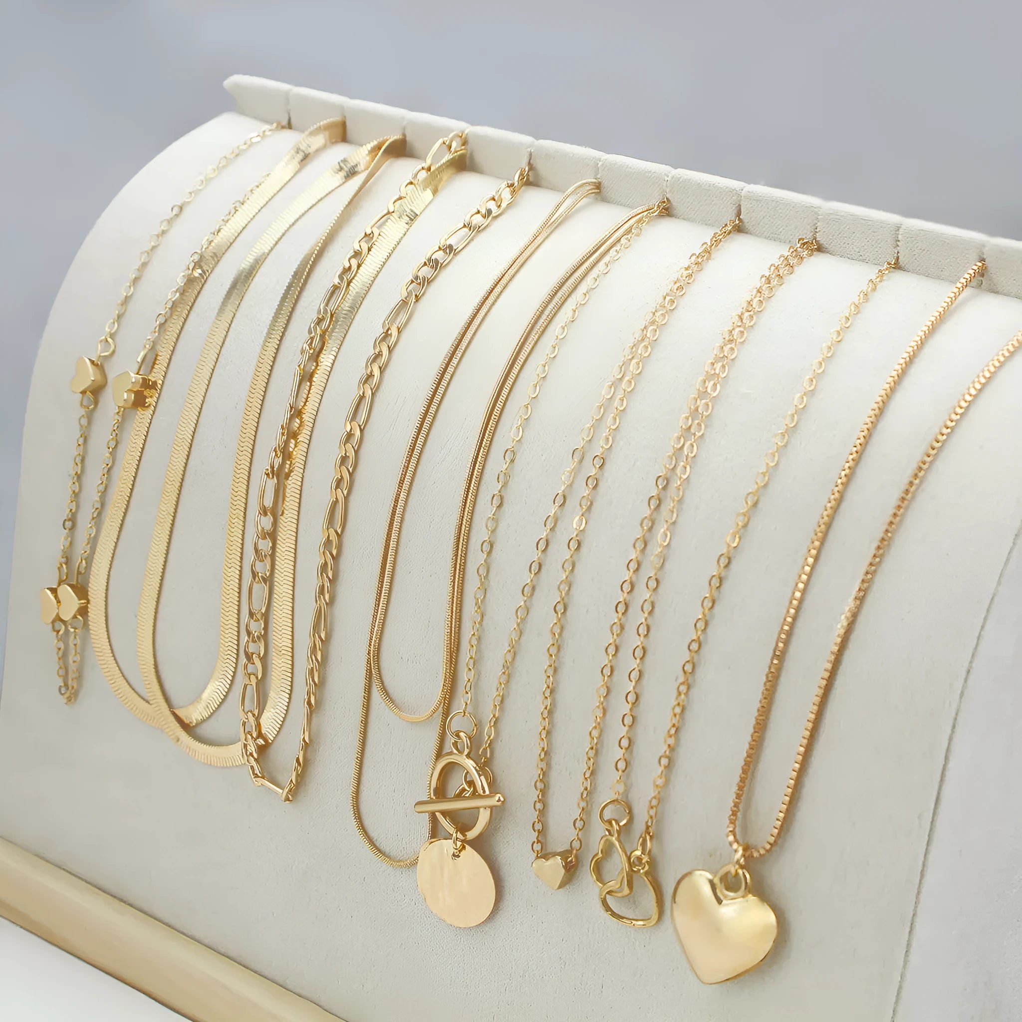 Women's gold electroplated necklace set with ten alloy pendants on adjustable snake bones chain