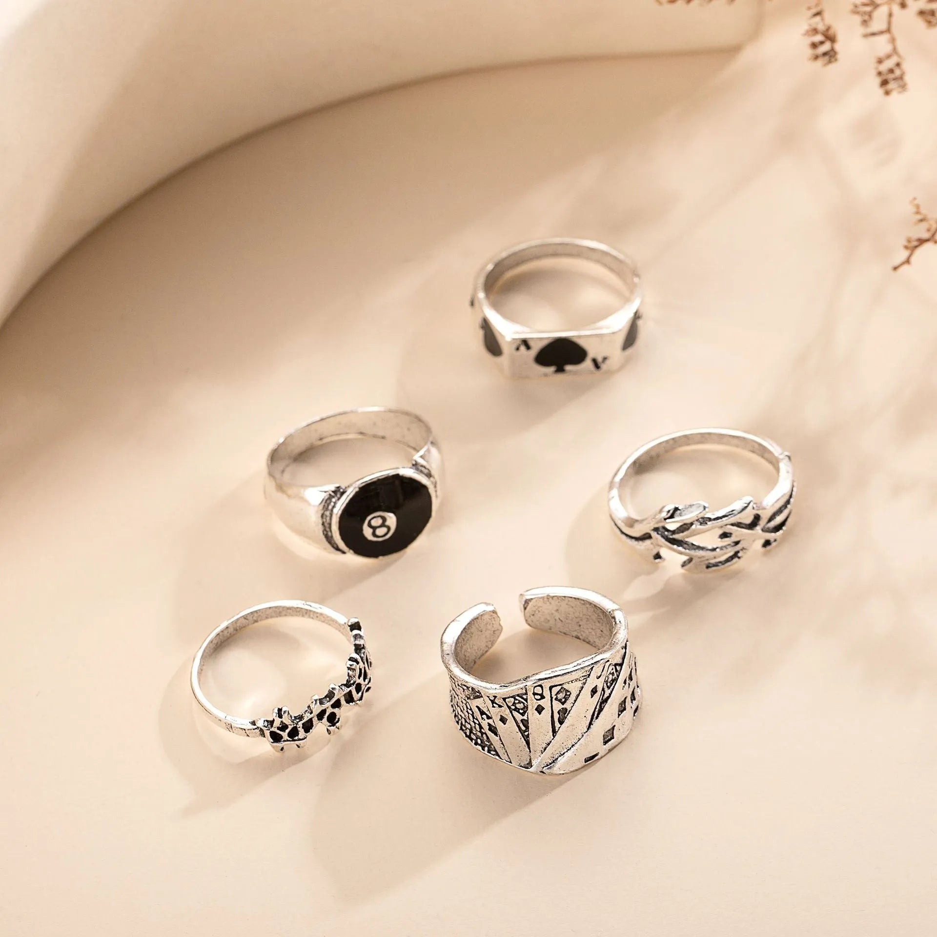 Close-up of a black zinc alloy ring with a detailed retro spade charm on an adjustable band.