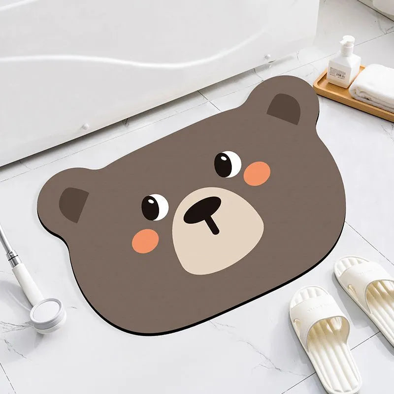 Cartoon animal diatomite bathroom mat in alien shape on tiled floor.