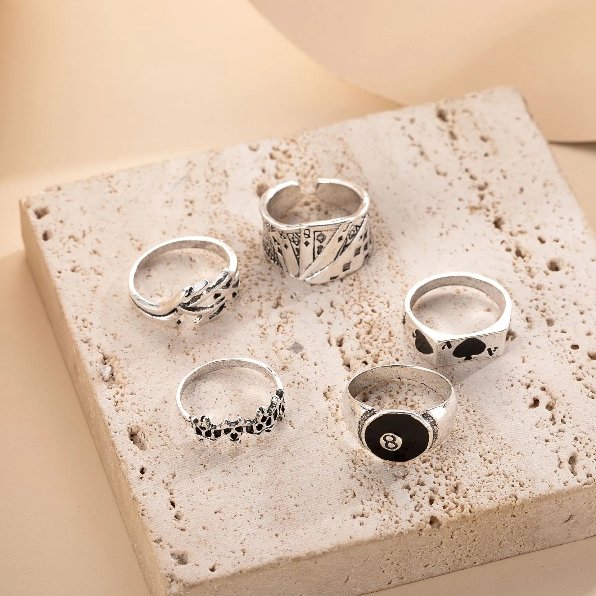 Close-up of a black zinc alloy ring with a detailed retro spade charm on an adjustable band.