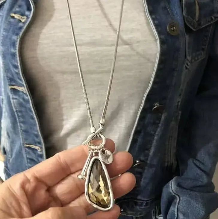 Long geometric sweater chain necklace with alloy water drop pendant on snake bones chain.
