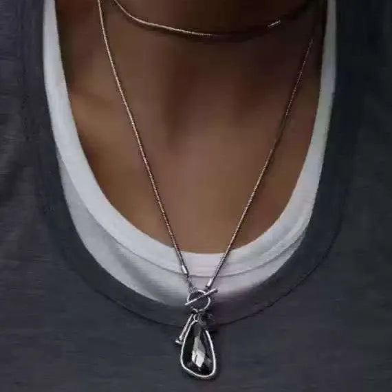 Long geometric sweater chain necklace with alloy water drop pendant on snake bones chain.