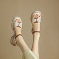 Women's khaki chunky heel platform sandals with open toe and rubber sole.