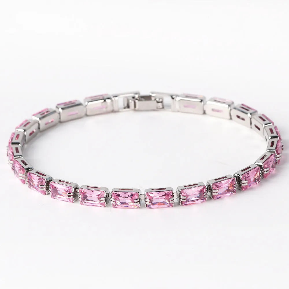 Adjustable electroplated zircon bracelet in gold finish with coloured zircon accents