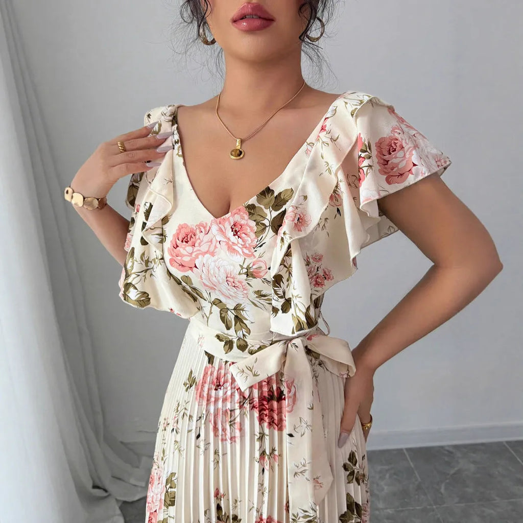 Apricot floral print women's dress with V-neck, ruffled sleeves, and oversized swing skirt