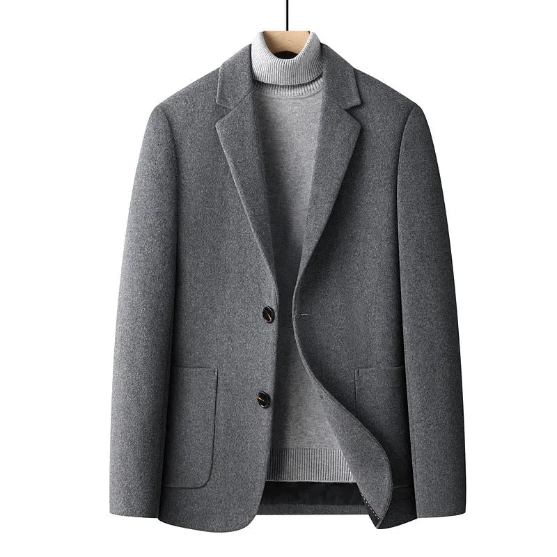 Men's slim fit wool suit jacket in grey shown on a model, suitable for autumn and winter wear.