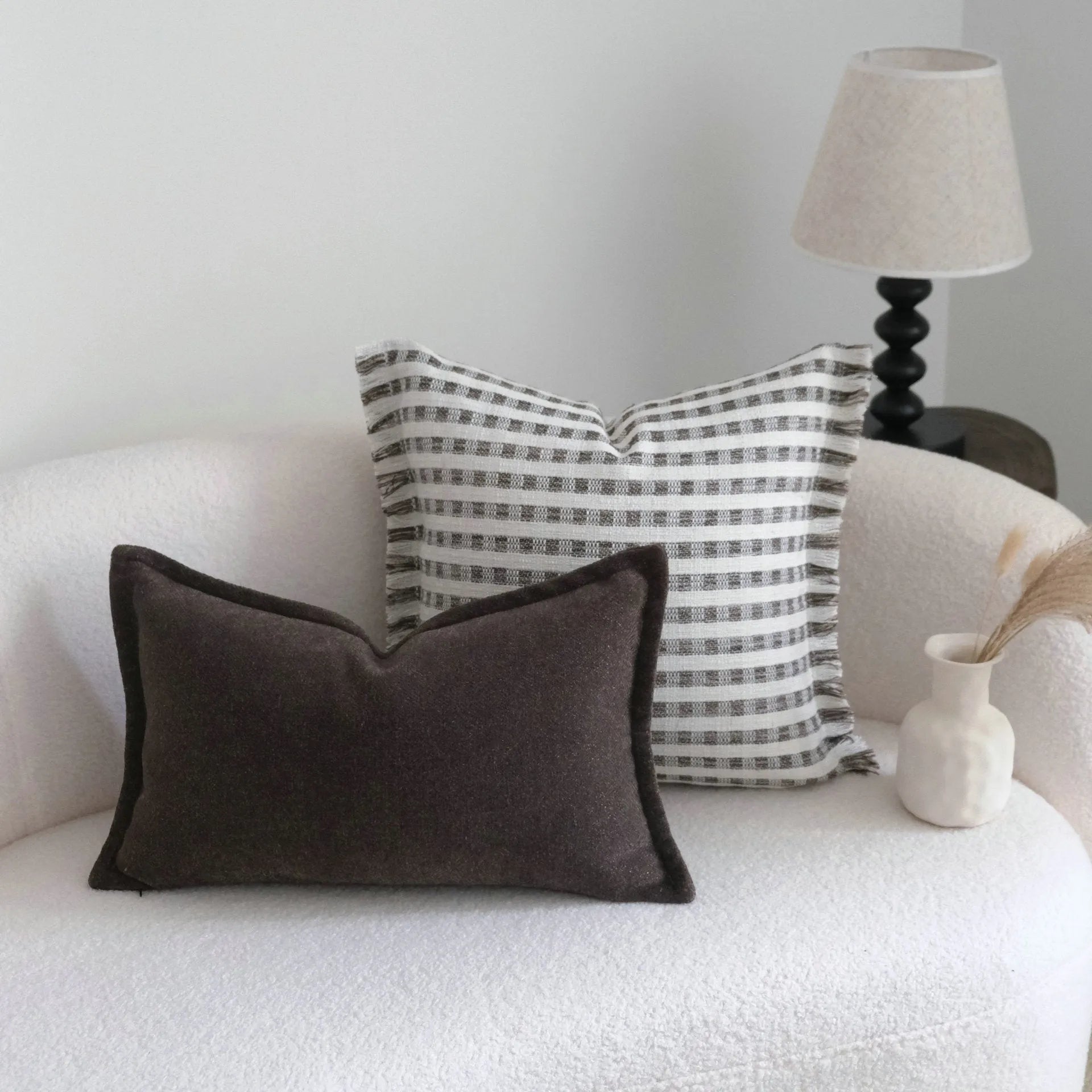 Coffee brown striped Chinese classical style cushion pillow on a sofa in 45x45cm size.