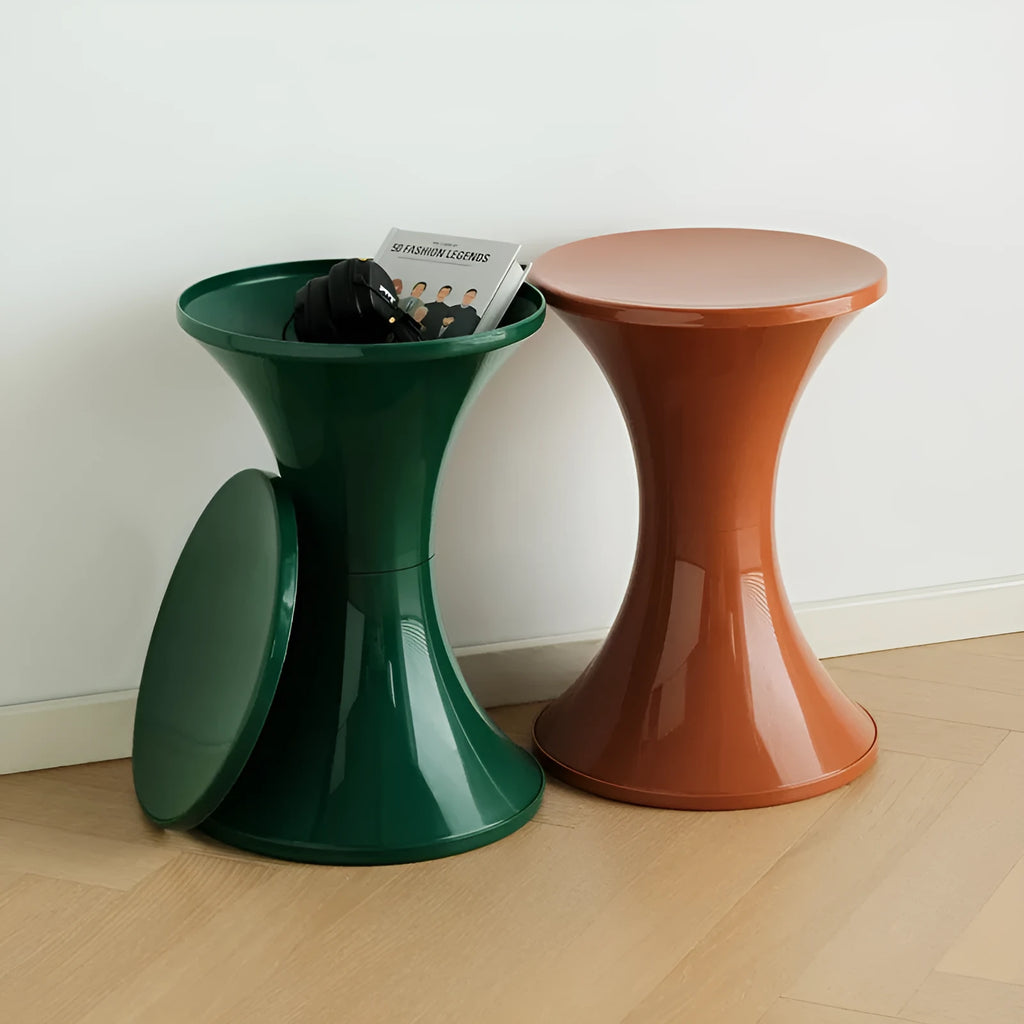 Green hourglass-shaped plastic stool for changing shoes, suitable for children and adults.