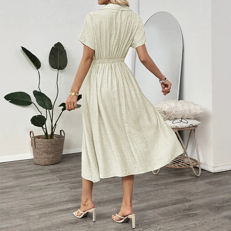 Light green twill shirtdress with lapel collar, waist-tight skirt, and commuter pocket design