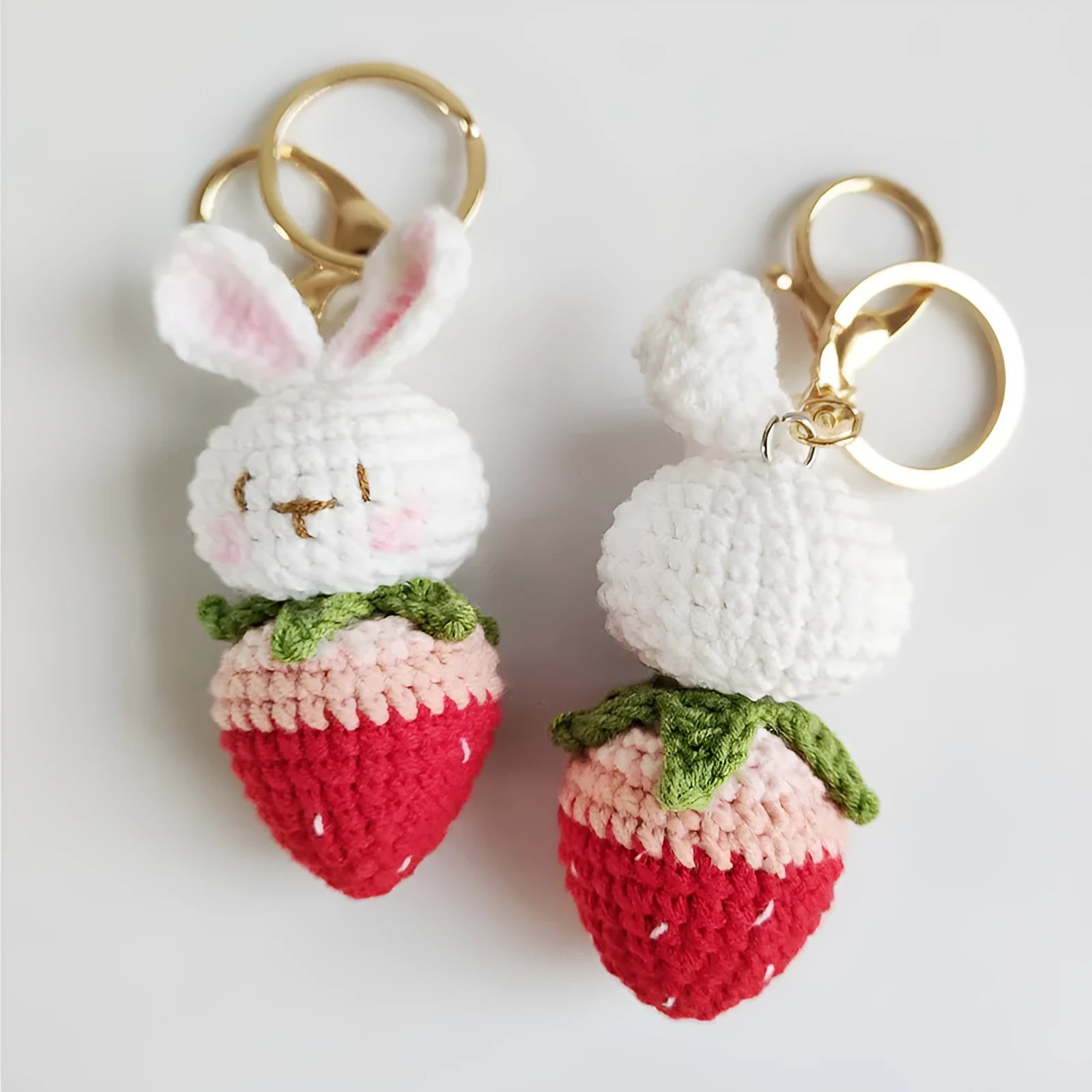 White hand-woven wire pendant with cartoon rabbit strawberry design and attached metal key