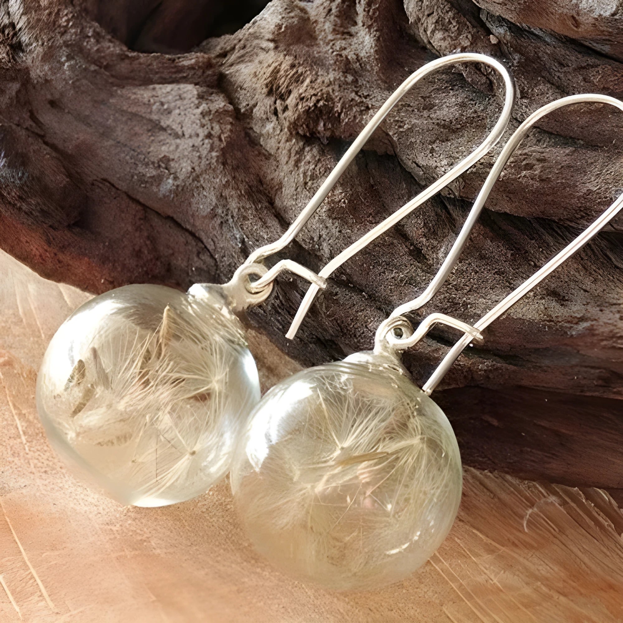 Transparent glass earrings with crystal dandelion seed design on French hooks