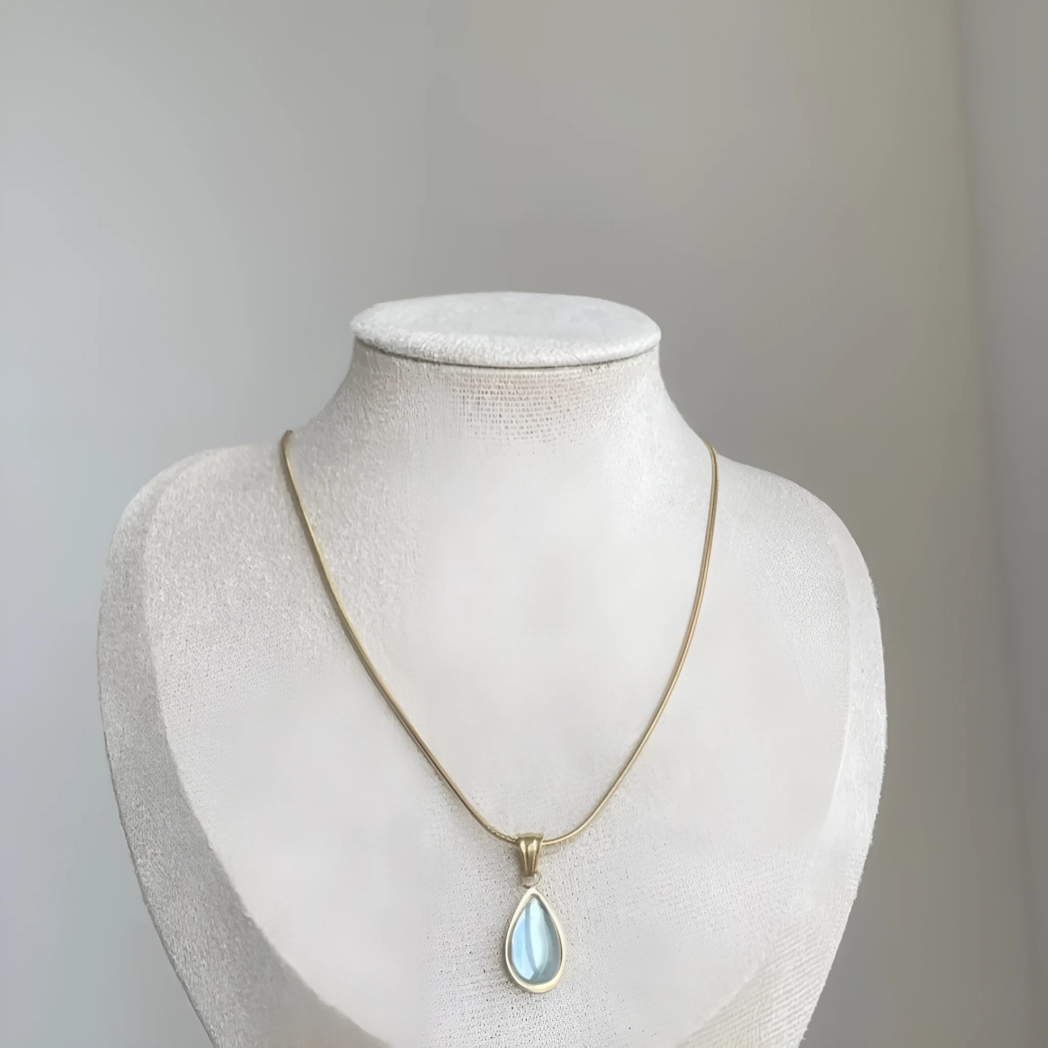 Retro blue and green water drop necklace with gemstone inlay on a titanium steel snake bone chain.