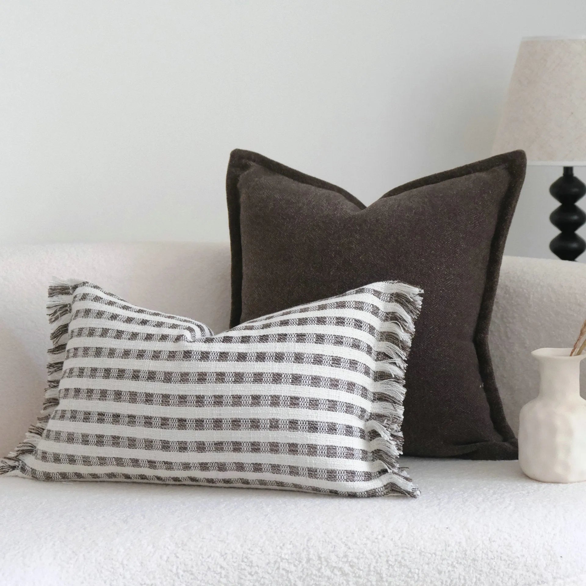 Coffee brown striped Chinese classical style cushion pillow on a sofa in 45x45cm size.