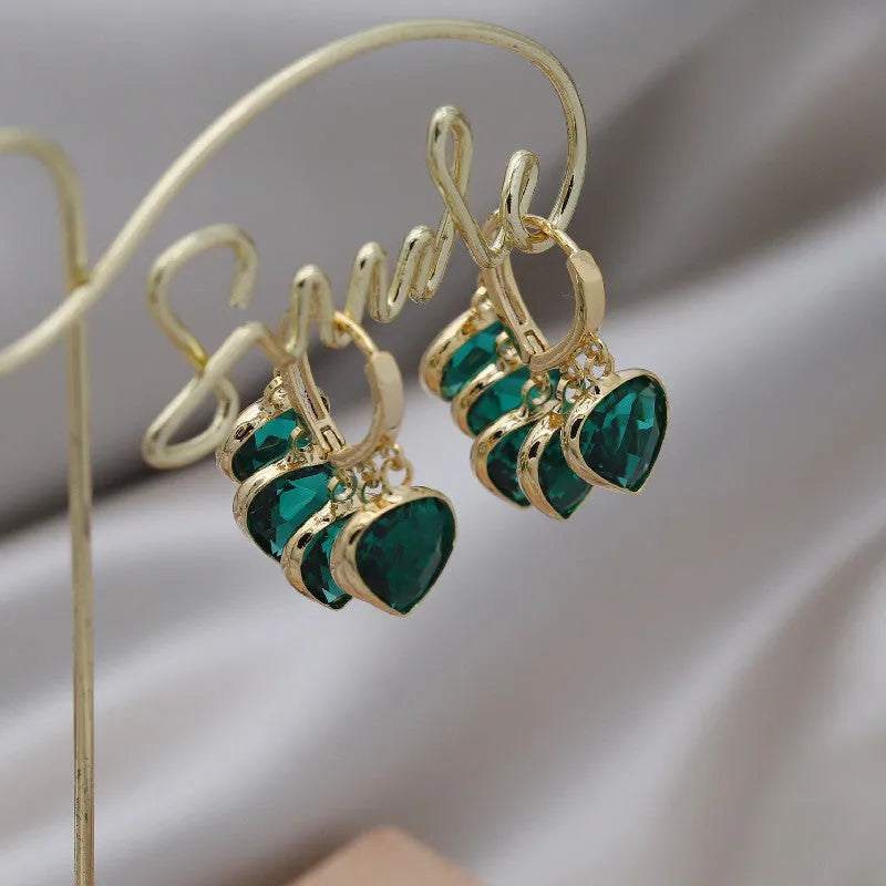 Korean style green heart pendant glass ear clips with copper construction and alloy inlay detailing