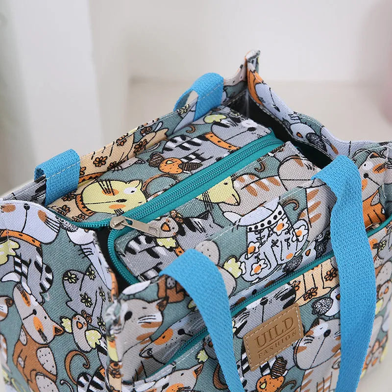 Women's printed canvas bag with aluminium frame showing floral pattern design and horizontal square shape