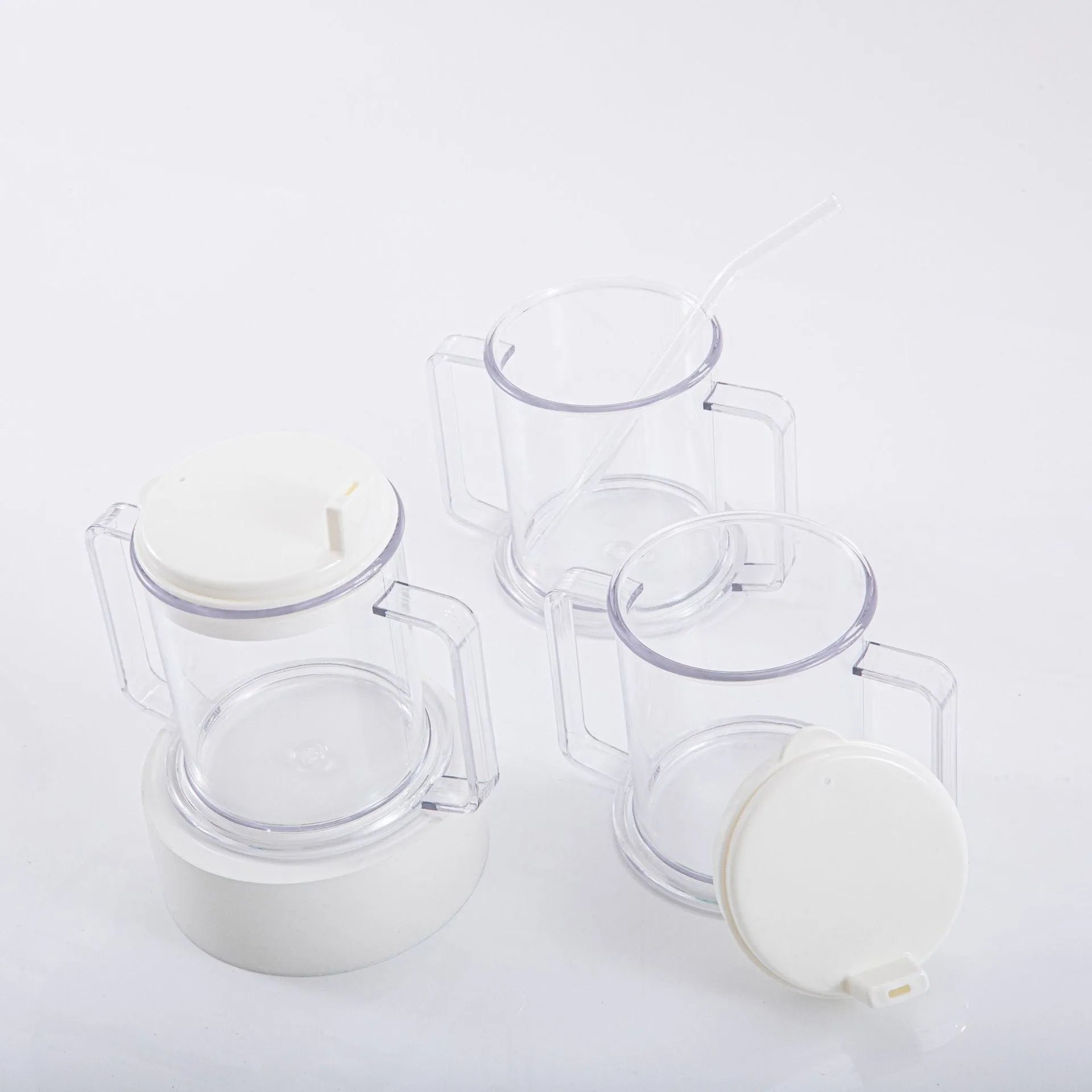 Transparent lightweight plastic drinking cup with spill-proof design on a plain background