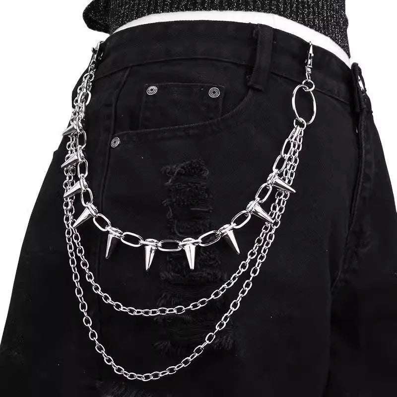 Silver metal double-layer rivet chain trousers accessory with zip fastening on a dark background.