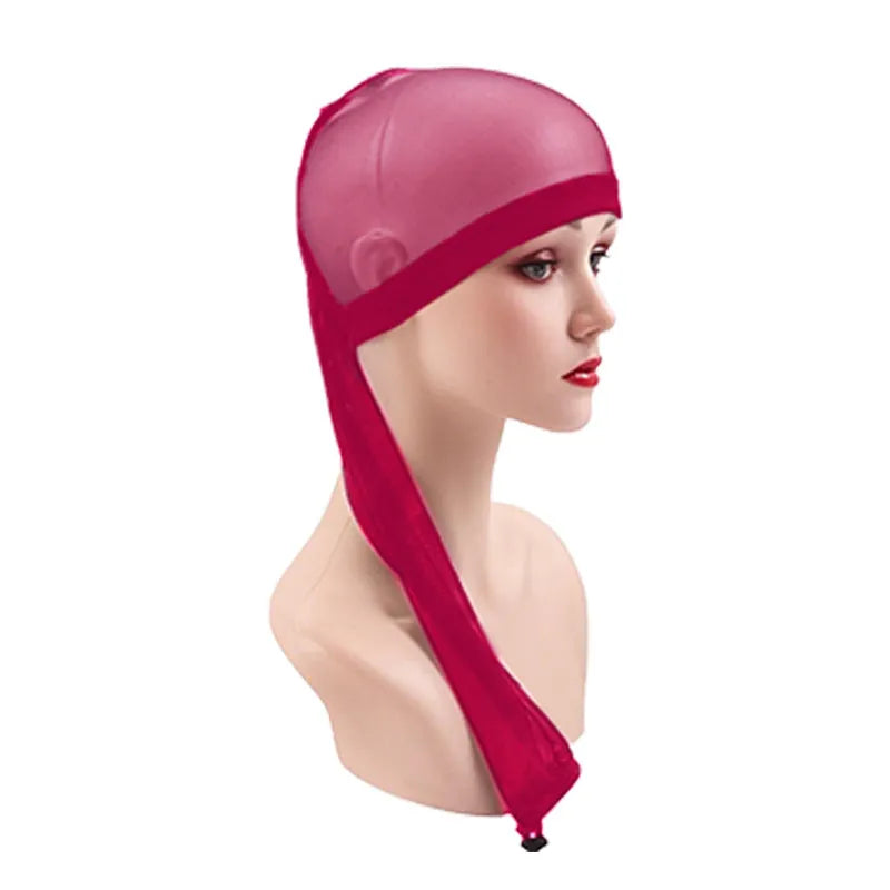 Breathable spandex mesh wig cap shown in multiple colour options including black, brown, leopard, and pastels.