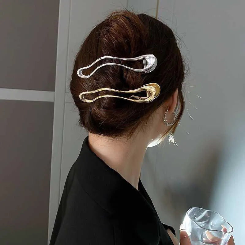 Gold and silver zinc alloy hair clip barrettes in arc, square, and triangle shapes.