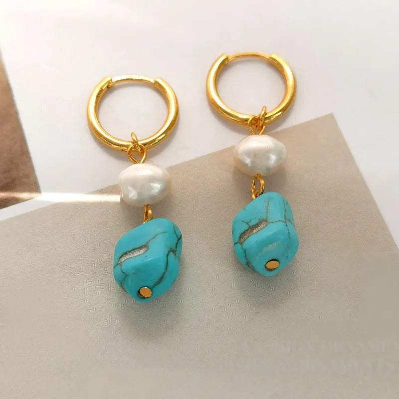 A pair of short and a pair of dangle geometric turquoise copper earrings.