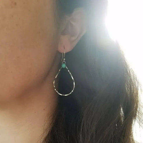 Bohemian style geometric circle earrings with antique silver finish and turquoise accent