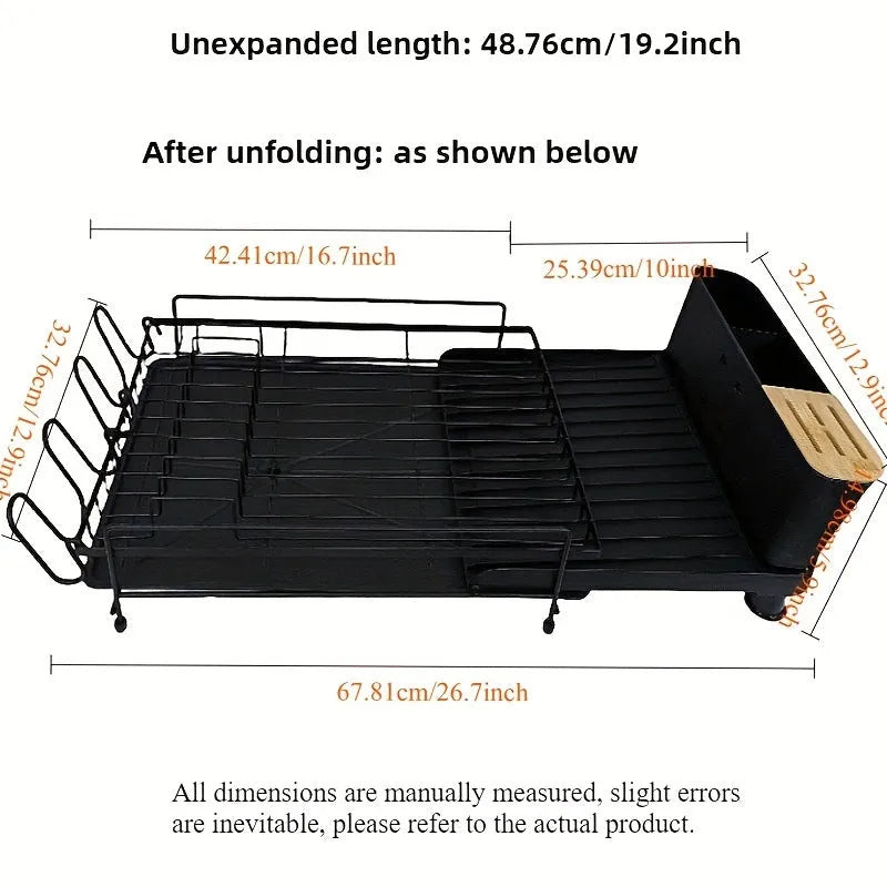 Foldable carbon steel dish drain rack holding cutlery and cups on a kitchen counter.