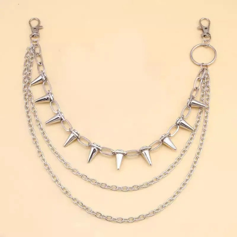 Silver metal double-layer rivet chain trousers accessory with zip fastening on a dark background.