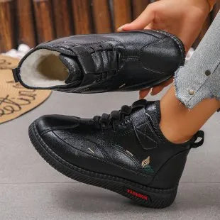 Women's black velvet shoes with non-slip rubber sole and hollow-out pattern.