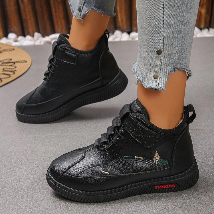 Women's black velvet shoes with non-slip rubber sole and hollow-out pattern.