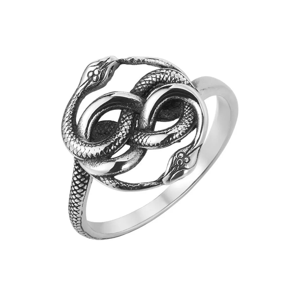 Close-up of a steel-coloured titanium steel double snake ring on a hand, showing retro design.