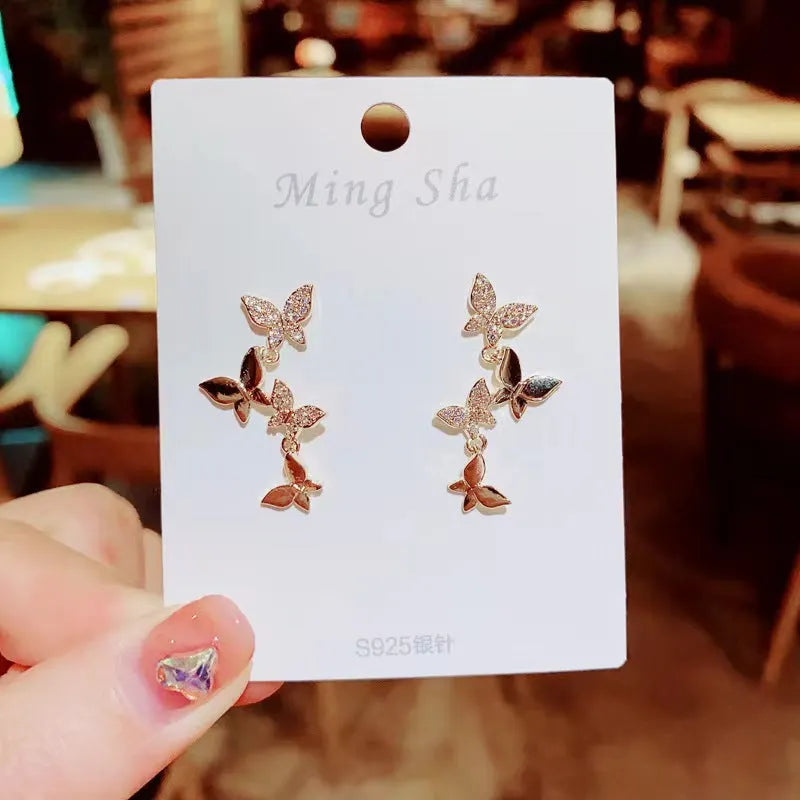 Gold colour copper butterfly earrings for women with four butterfly drop design