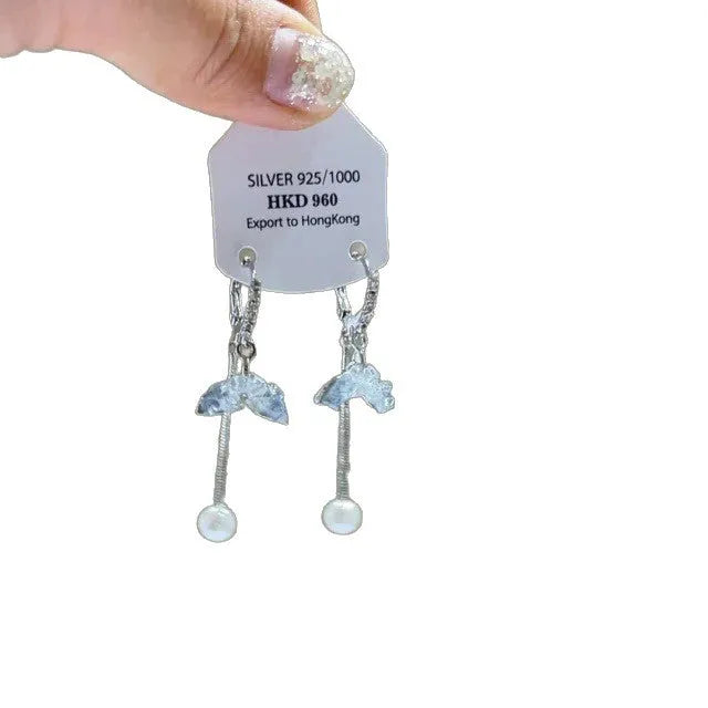 Pair of geometric heart-shaped alloy ear clips with rhinestones and a tassel.