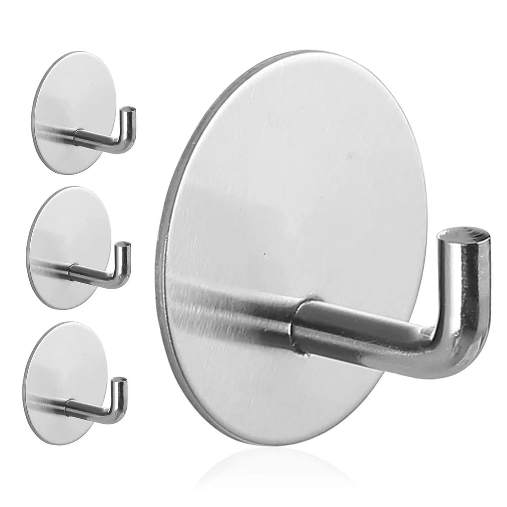 Stainless steel round self-adhesive hook for wall mounting.