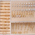 108 geometric alloy earrings with electroplated gold and yellow finishes showing round design elements
