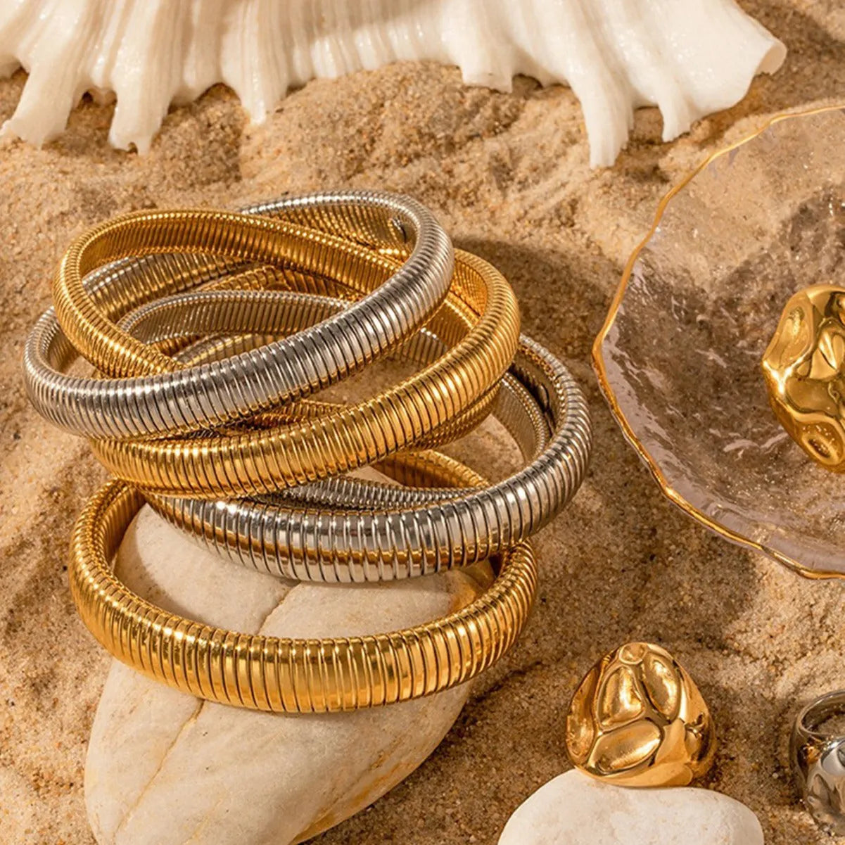 Women's titanium steel bracelet with vertical stripe pattern in gold or silver finish