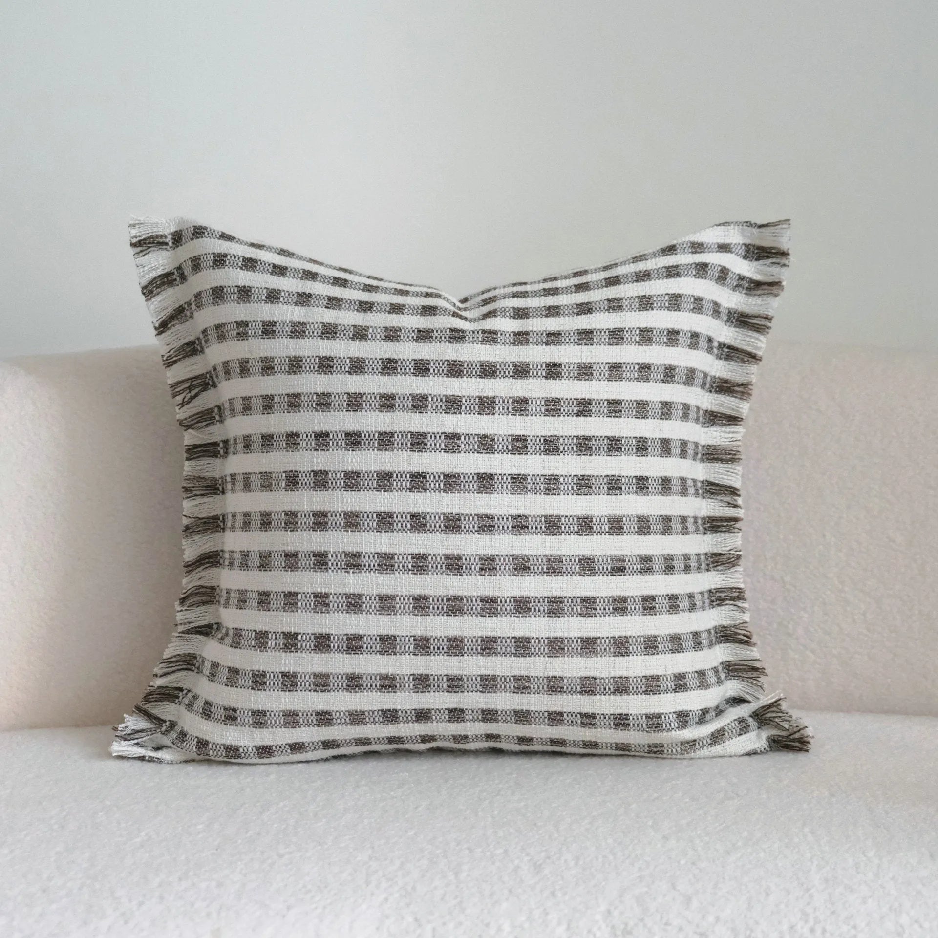 Coffee brown striped Chinese classical style cushion pillow on a sofa in 45x45cm size.