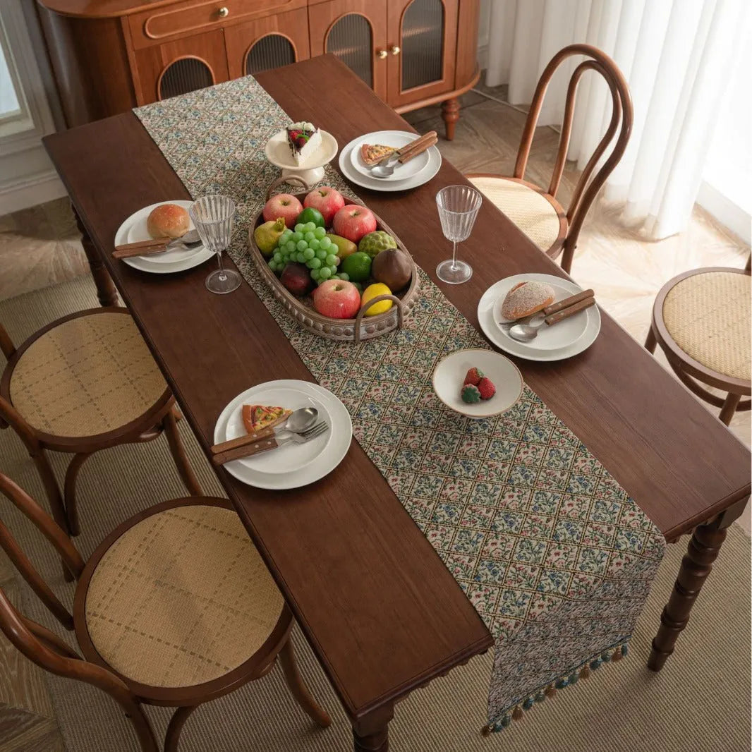 Nordic jacquard bouquet pattern table runner with decorative tassel trim in dark blue colour