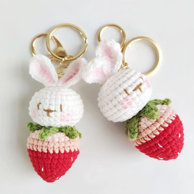 White hand-woven wire pendant with cartoon rabbit strawberry design and attached metal key