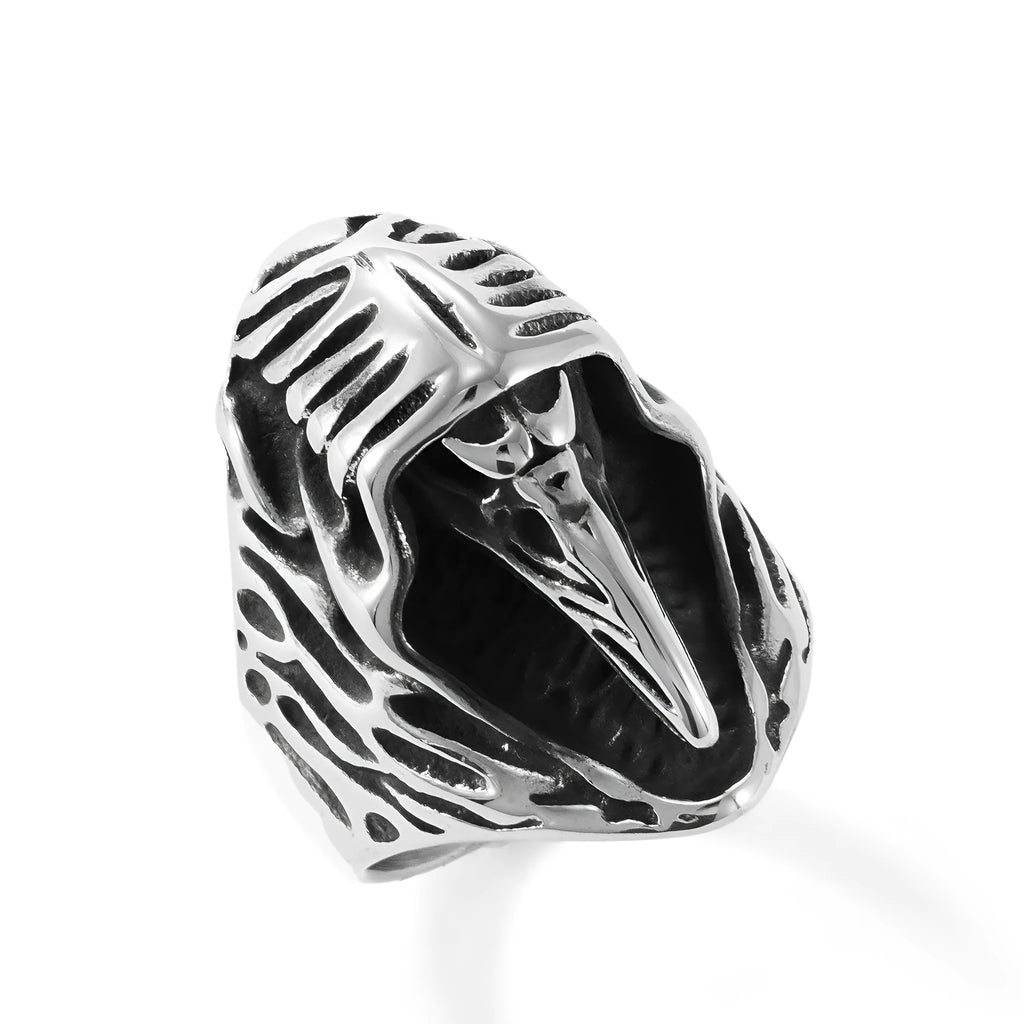 Geometric titanium steel crow ring in a punk retro style on a grey background.