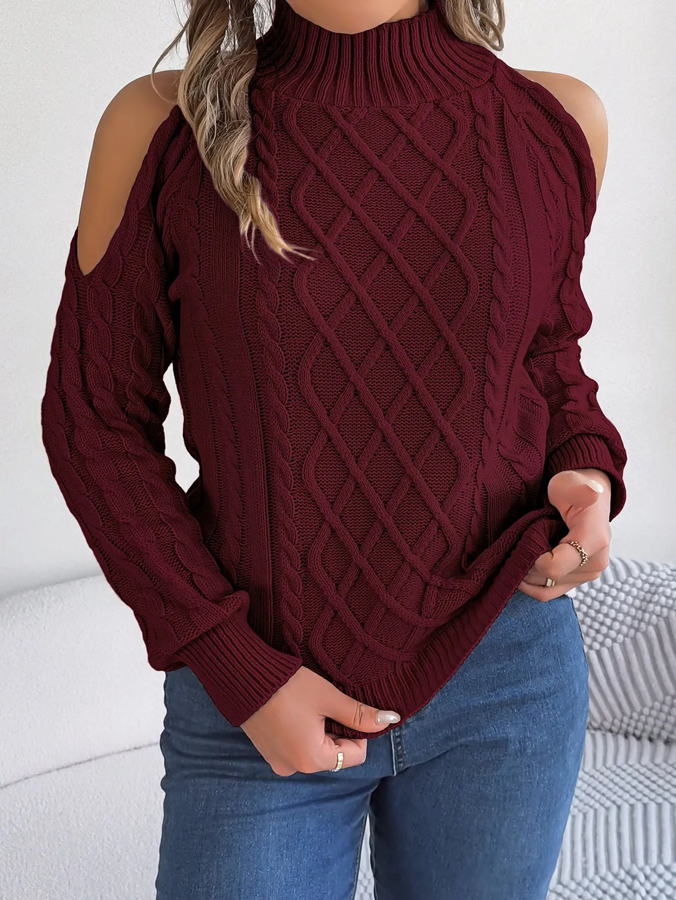 Gray women's strapless pullover sweater with a twist pattern detail and long lantern sleeves.