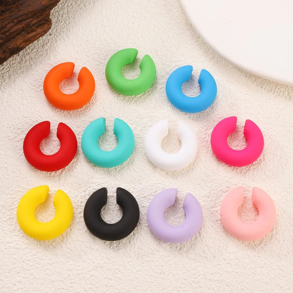 Geometric C-shape clip-on earrings with matte coarse finish in candy colours for women without pierced ears