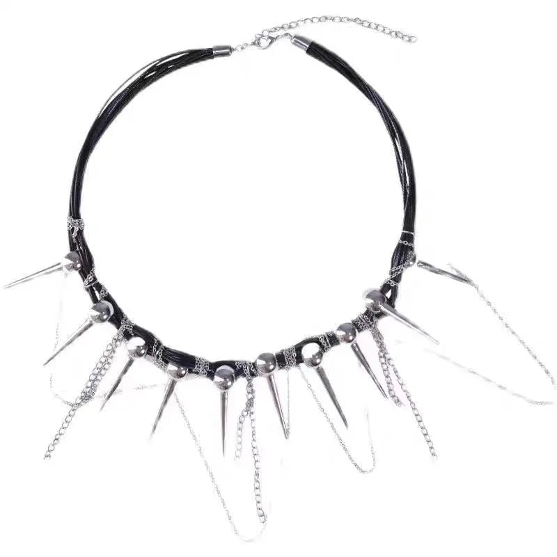 Women's leather necklace with round beads, a winding tassel, and silver point rivets on a casual outfit.