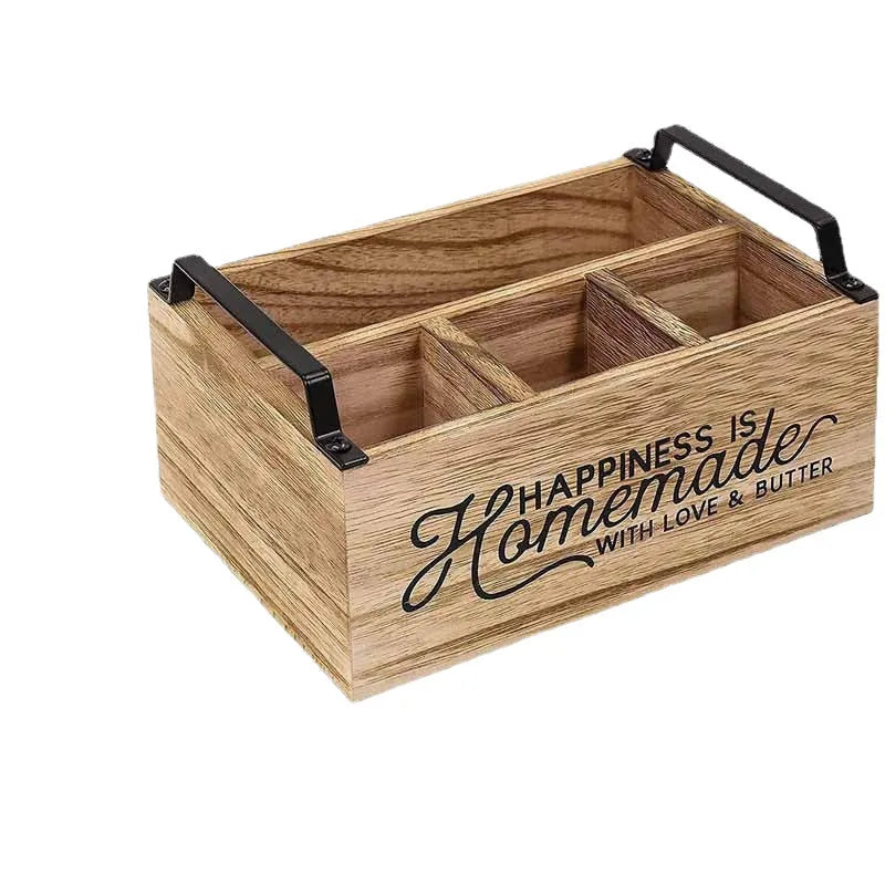 Modern minimalist wooden box with grid dividers for organising kitchen utensils.