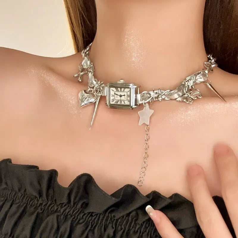 Dark electroplated multi-layer cross necklace with twin clavicle chains on display