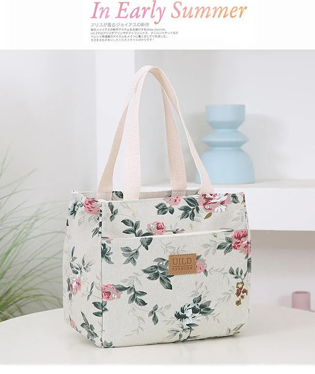 Women's printed canvas bag with aluminium frame showing floral pattern design and horizontal square shape