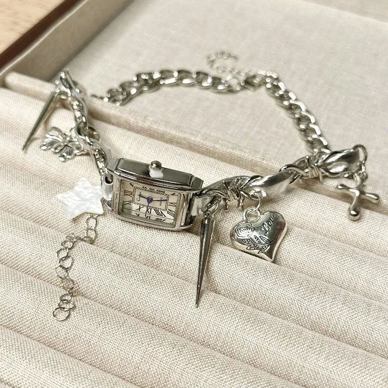Dark electroplated multi-layer cross necklace with twin clavicle chains on display