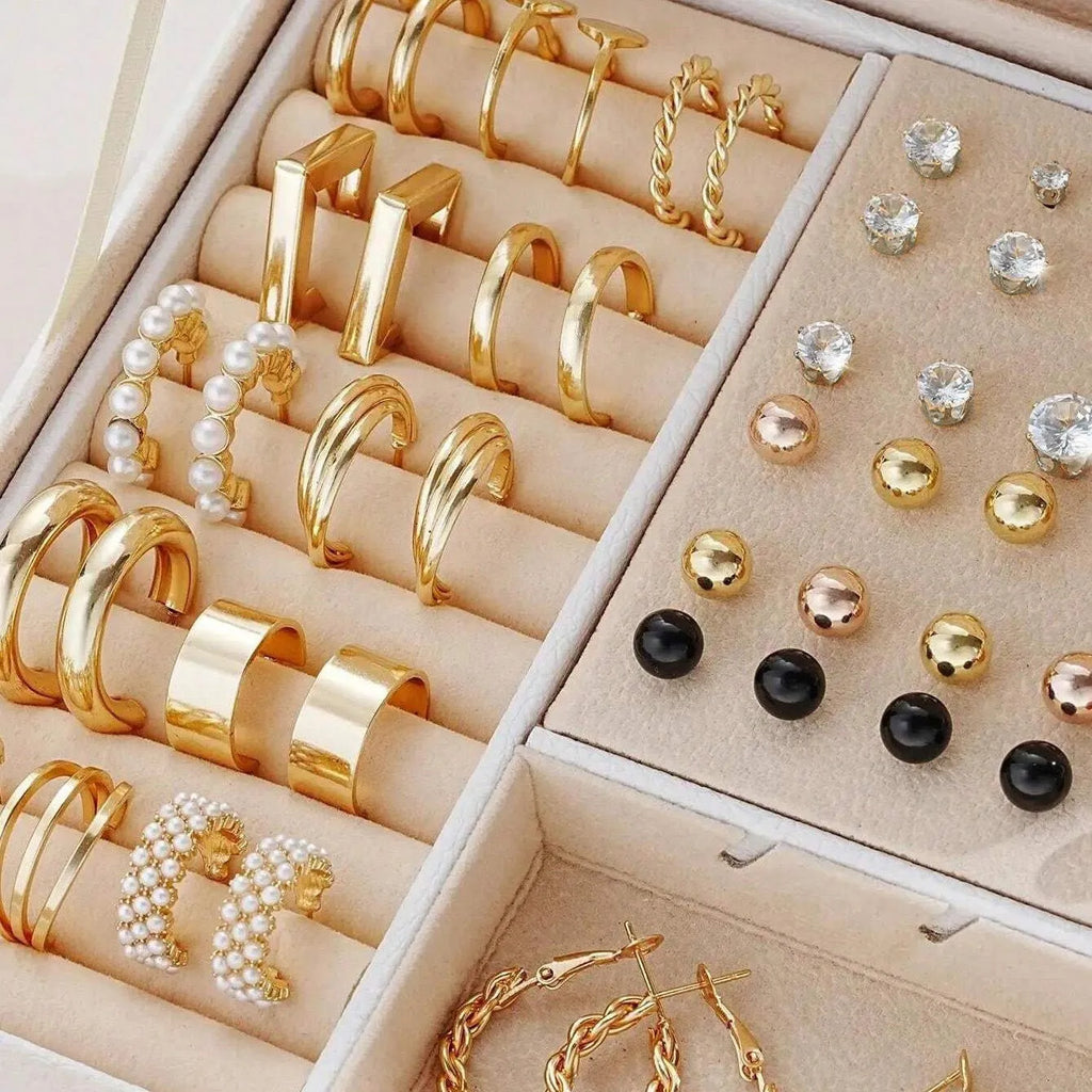 108 geometric alloy earrings with electroplated gold and yellow finishes showing round design elements