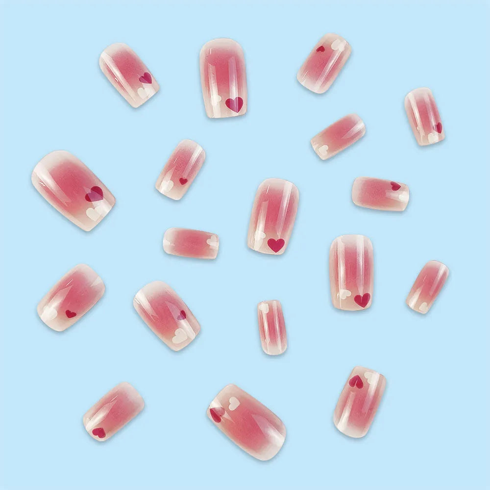 Red and white love gradient nail stickers with starry sky pattern and glue tube