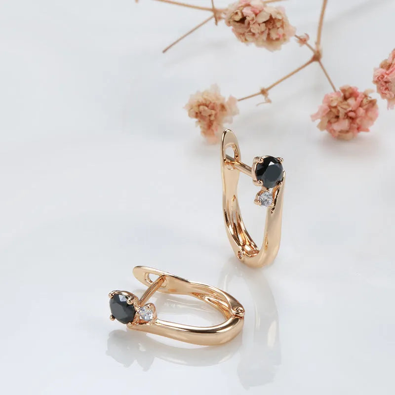 Women's black agate earrings with gold-plated finish and geometric drop shape design